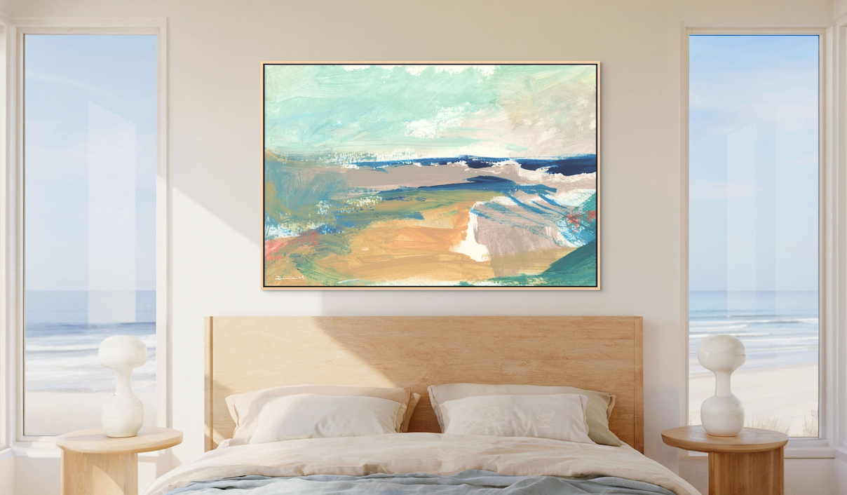 Abstract pastel artwork styled above a coastal bedroom bed with soft neutral bedding